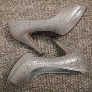 Gently used sparkly high heel with peep toe
